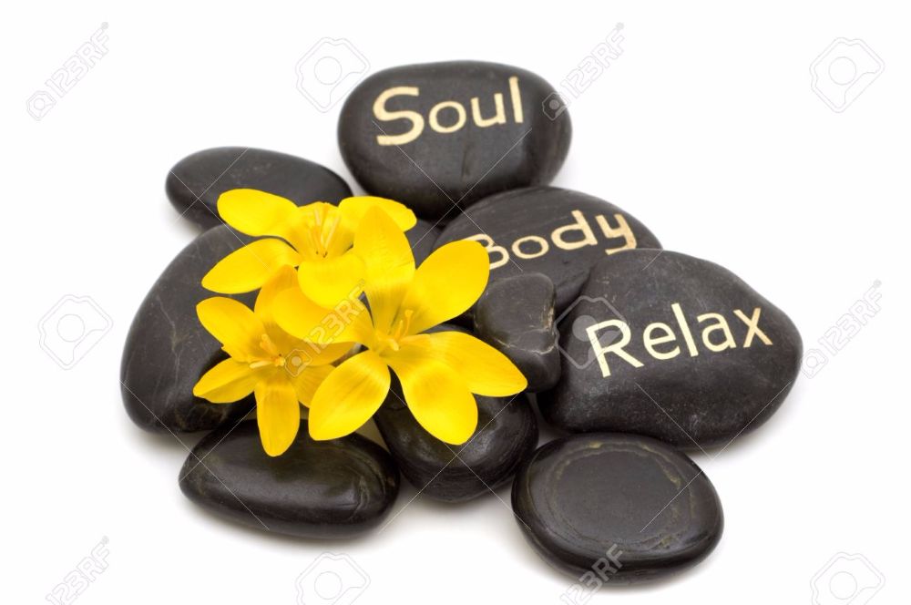 massage stones and flowers