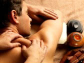 18352382-masseur-doing-massage-on-man-body-in-the-spa-salon-beauty-treatment-concept
